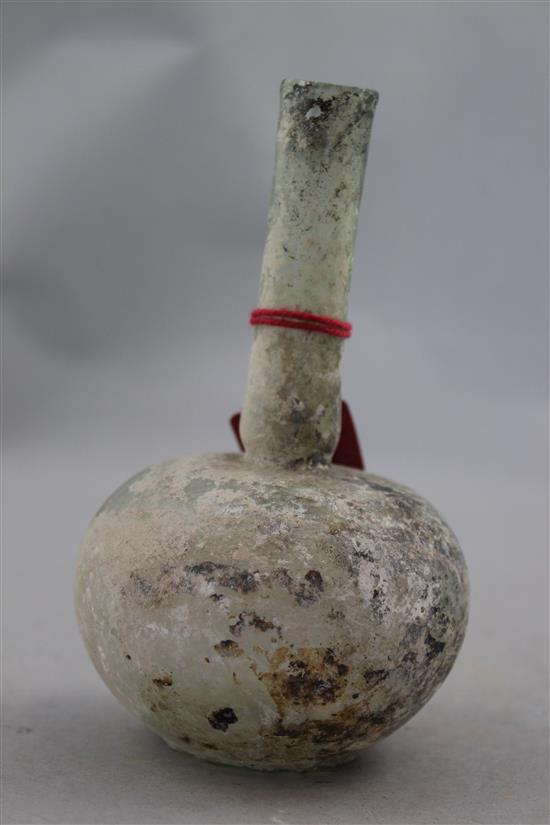 A Roman clear glass flask, c.1st / 2nd century AD, 14.5cm